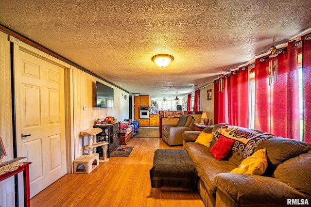 1425 N Vaughn Ave, West Peoria, IL 61604 - living area with a textured ceiling and light wood finished floors