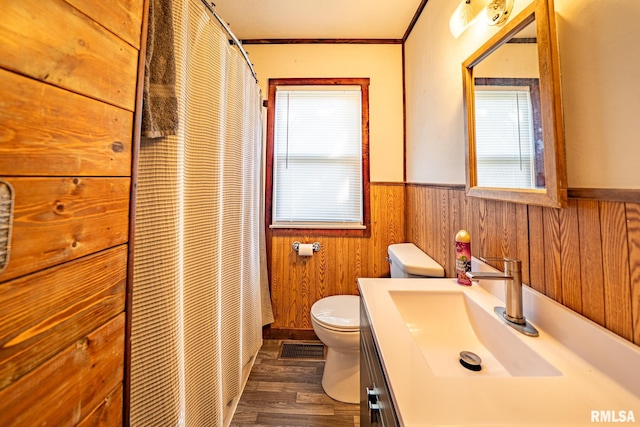 304 Meyers St, South Pekin, IL 61564 - bathroom with healthy amount of natural light, wainscoting, toilet, vanity, and wood finished floors