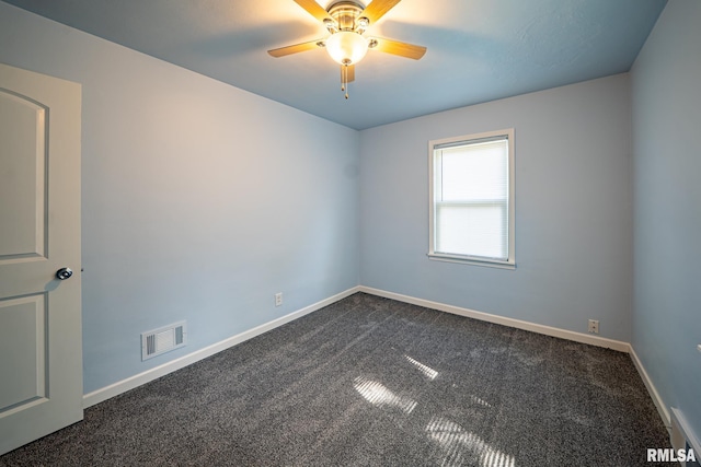 304 Meyers St, South Pekin, IL 61564 - unfurnished room with dark colored carpet, baseboards, and a ceiling fan