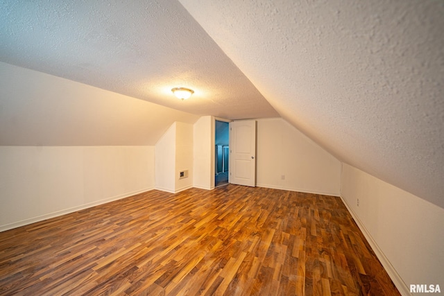 304 Meyers St, South Pekin, IL 61564 - bonus room featuring a textured ceiling, wood finished floors, lofted ceiling, and baseboards