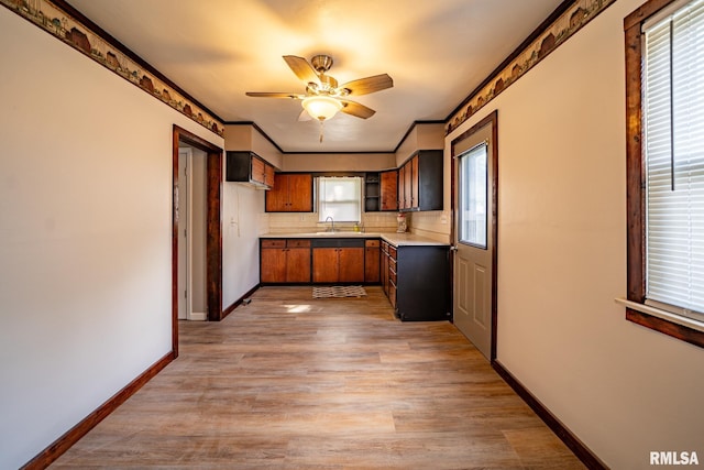 304 Meyers St, South Pekin, IL 61564 - kitchen with light wood-style floors, light countertops, baseboards, tasteful backsplash, and ceiling fan