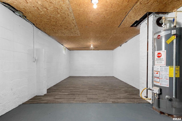 finished below grade area with water heater and concrete block wall