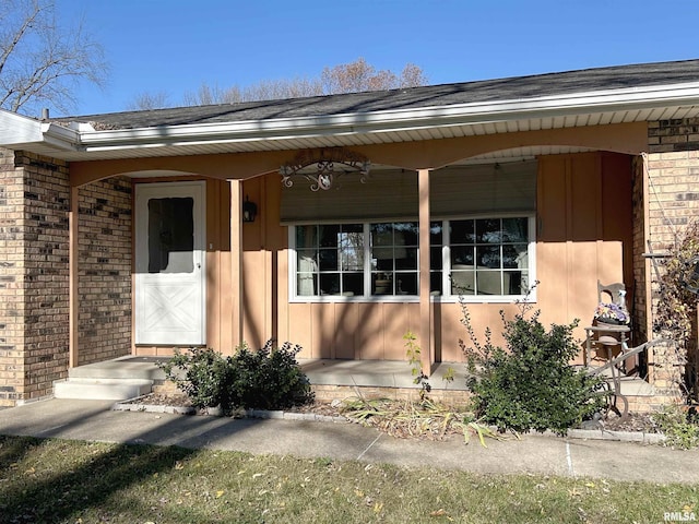entrance to property with brick siding
