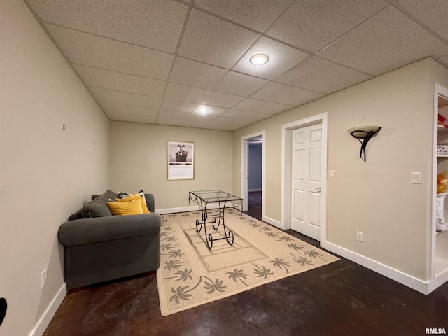 6 Marty Ln, Macomb, IL 61455 - living area featuring a paneled ceiling and concrete floors