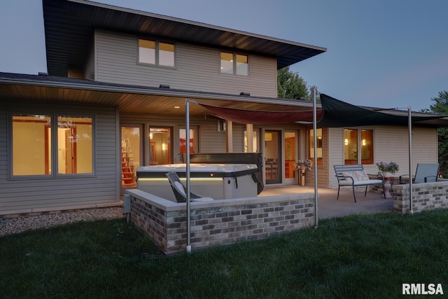 6 Marty Ln, Macomb, IL 61455 - rear view of house with a hot tub, a patio area, and a yard