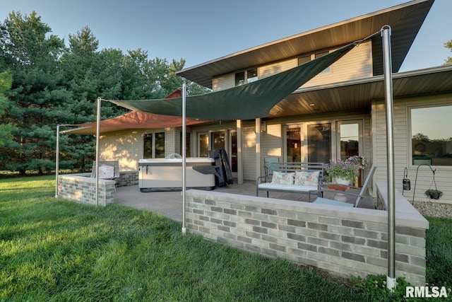 6 Marty Ln, Macomb, IL 61455 - rear view of house featuring a patio area, a yard, outdoor lounge area, and a hot tub