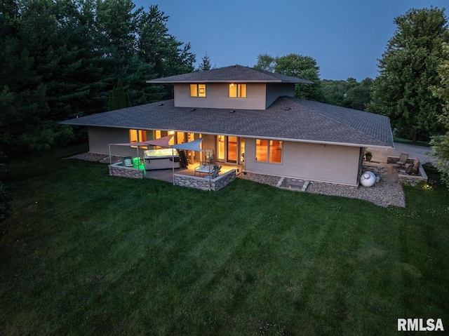 6 Marty Ln, Macomb, IL 61455 - back of property with a yard, a shingled roof, and a patio