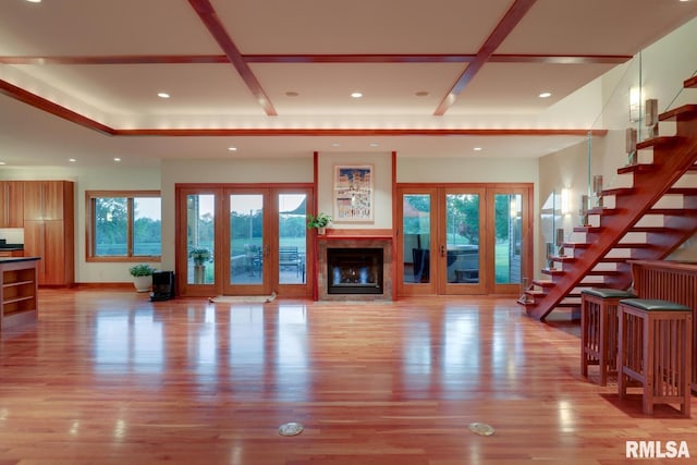 6 Marty Ln, Macomb, IL 61455 - unfurnished living room featuring recessed lighting, light wood finished floors, french doors, stairs, and a glass covered fireplace