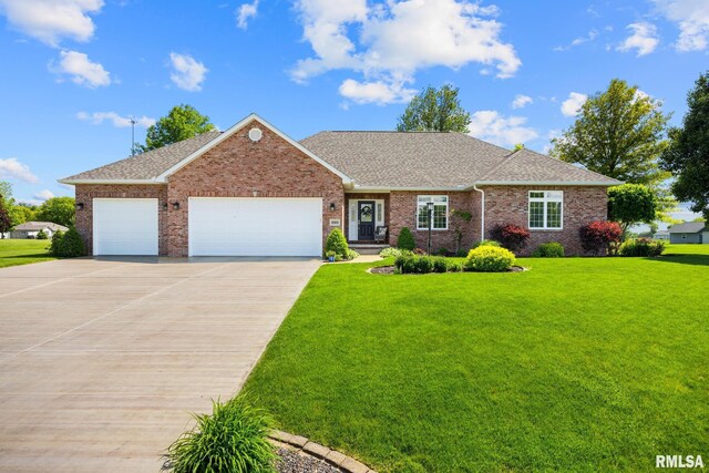 view of front of house with driveway, an attached garage, a front yard, a shingled roof, and brick siding