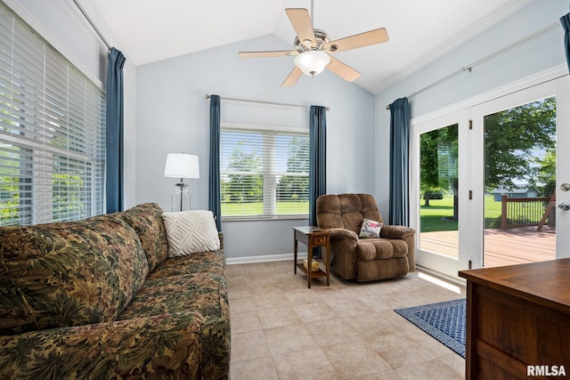 living room with vaulted ceiling, a ceiling fan, light tile patterned floors, and baseboards