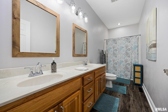 full bath with wood finished floors, toilet, double vanity, baseboards, and curtained shower