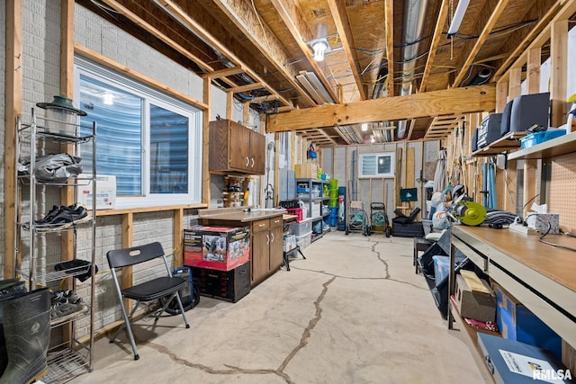 unfinished basement with a workshop area