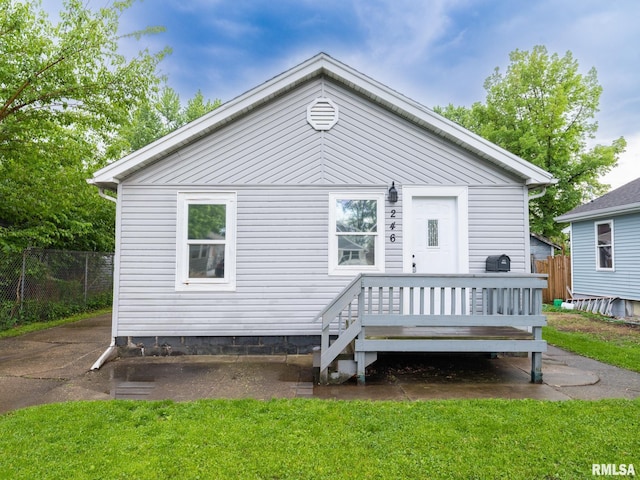 246 Herget St, Pekin, IL 61554 - back of house featuring fence and a wooden deck