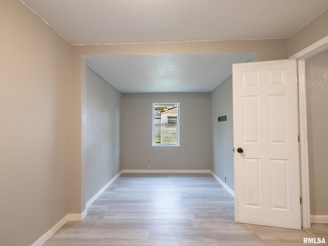 246 Herget St, Pekin, IL 61554 - spare room featuring light wood-style floors and baseboards