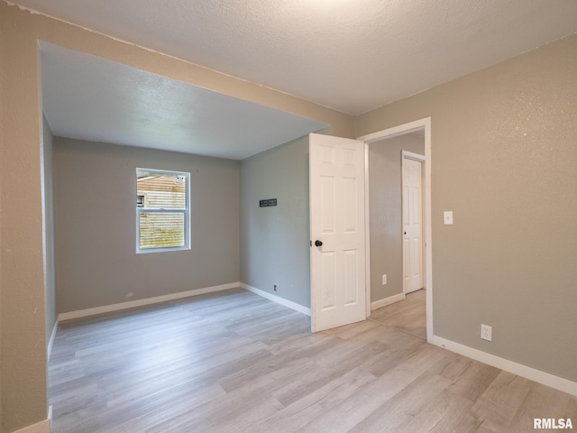 246 Herget St, Pekin, IL 61554 - unfurnished room with light wood-type flooring and baseboards