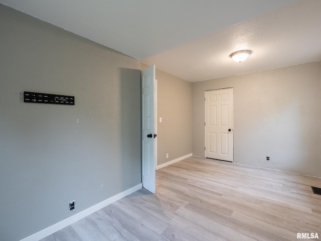 246 Herget St, Pekin, IL 61554 - spare room with light wood-type flooring and baseboards