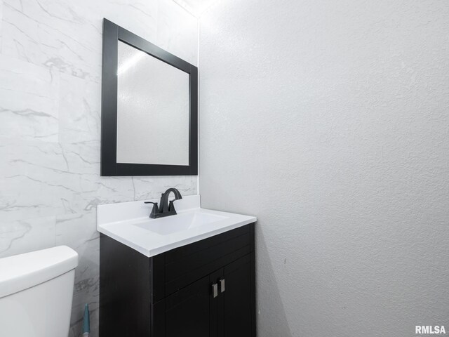 246 Herget St, Pekin, IL 61554 - bathroom featuring vanity and toilet