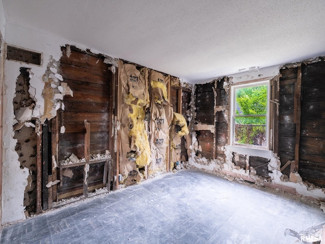 246 Herget St, Pekin, IL 61554 - unfurnished living room featuring a textured ceiling