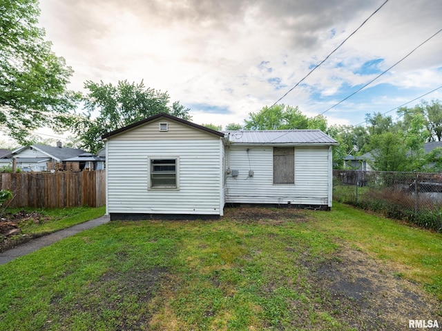 246 Herget St, Pekin, IL 61554 - back of house featuring metal roof