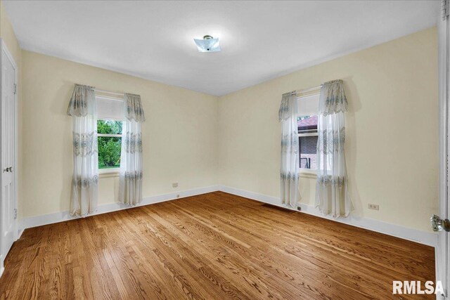 2309 W Manor Pkwy, West Peoria, IL 61604 - spare room with wood finished floors and baseboards