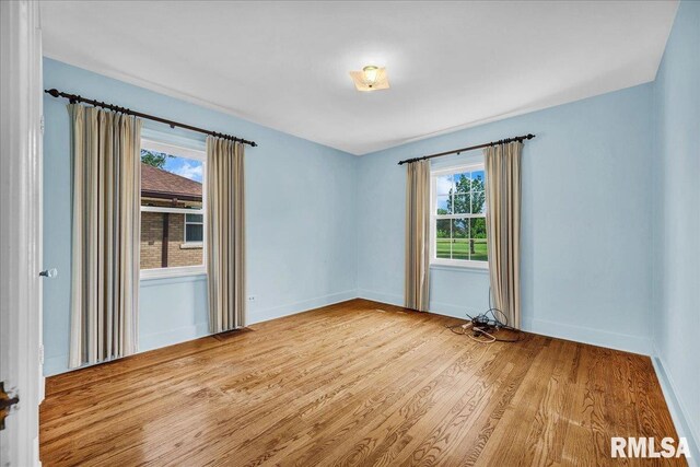 2309 W Manor Pkwy, West Peoria, IL 61604 - spare room with wood finished floors and baseboards