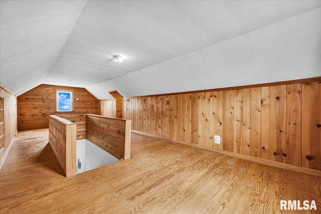 2309 W Manor Pkwy, West Peoria, IL 61604 - additional living space with wood walls, wood finished floors, and vaulted ceiling