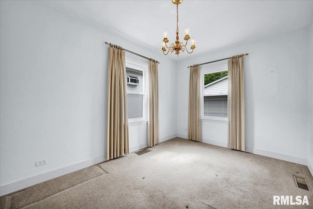2309 W Manor Pkwy, West Peoria, IL 61604 - carpeted empty room featuring a chandelier and baseboards