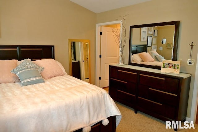 bedroom featuring light carpet