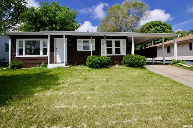 109 N 19th St, Pekin, IL 61554 - view of front facade with a front lawn, a carport, and driveway