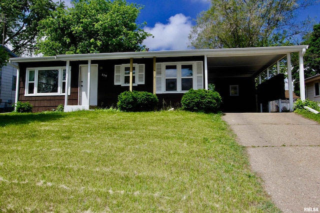 109 N 19th St, Pekin, IL 61554 - view of front of property with driveway, a front lawn, and an attached carport