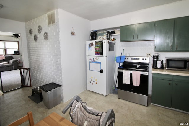 109 N 19th St, Pekin, IL 61554 - kitchen with green cabinets, appliances with stainless steel finishes, a ceiling fan, tasteful backsplash, and light countertops