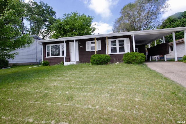 109 N 19th St, Pekin, IL 61554 - view of front facade featuring a front yard, driveway, and a carport