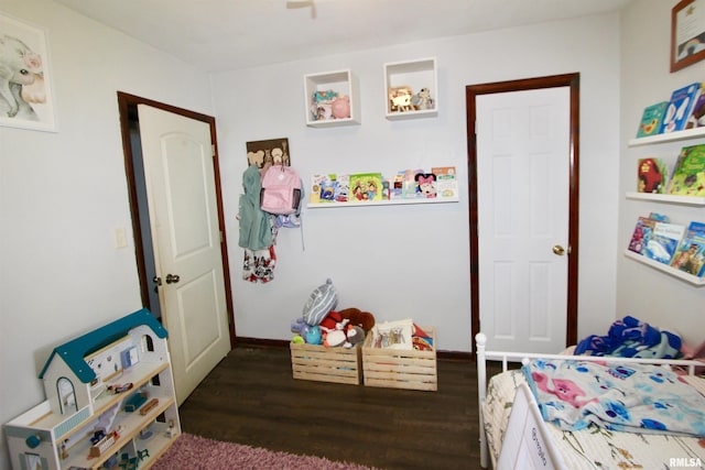 109 N 19th St, Pekin, IL 61554 - bedroom with dark wood-style flooring and baseboards