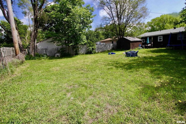 109 N 19th St, Pekin, IL 61554 - view of yard with a trampoline, a shed, and an outdoor structure