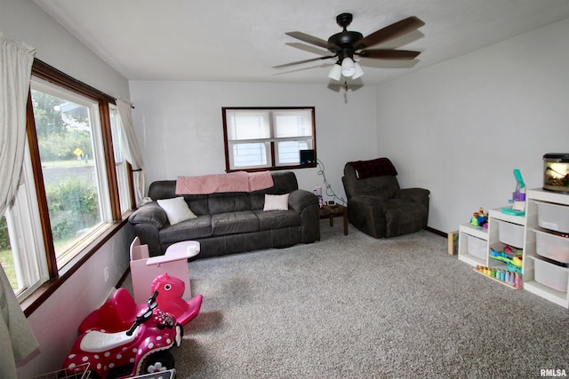 109 N 19th St, Pekin, IL 61554 - living area with healthy amount of natural light, carpet, and ceiling fan
