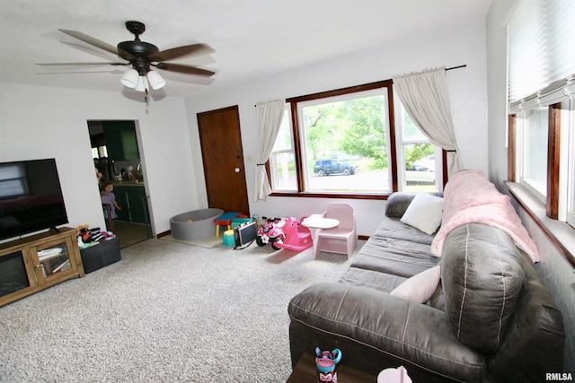 109 N 19th St, Pekin, IL 61554 - carpeted living area with a ceiling fan and baseboards