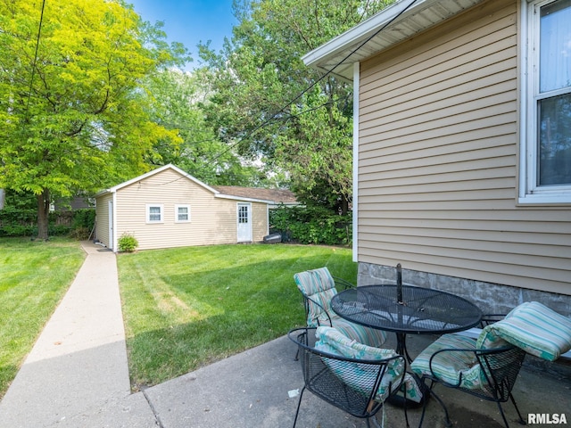 1218 N Sheridan Rd, Peoria, IL 61606 - view of patio / terrace with outdoor dining area and an outbuilding