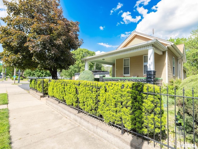 1218 N Sheridan Rd, Peoria, IL 61606 - view of home's exterior featuring covered porch and fence
