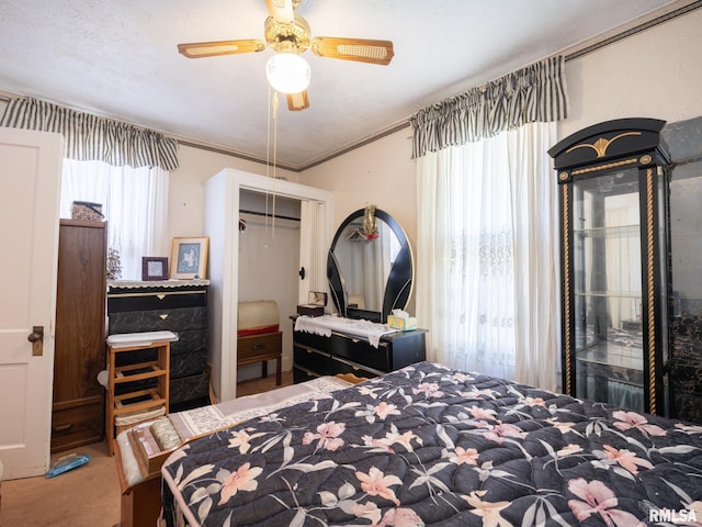 1218 N Sheridan Rd, Peoria, IL 61606 - bedroom featuring carpet flooring, a closet, and ceiling fan