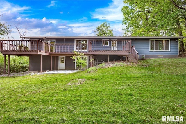 153 Spring Creek Ter, East Peoria, IL 61611 - rear view of property featuring a wooden deck, a lawn, and a patio area