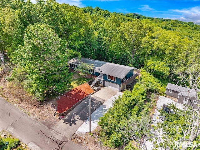 153 Spring Creek Ter, East Peoria, IL 61611 - aerial view of property and surrounding area with a heavily wooded area