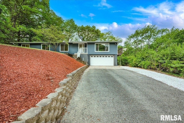 153 Spring Creek Ter, East Peoria, IL 61611 - view of front of house with driveway and a garage
