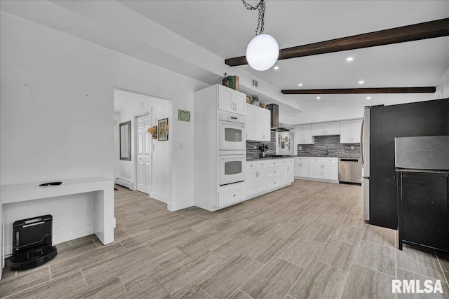 153 Spring Creek Ter, East Peoria, IL 61611 - kitchen with appliances with stainless steel finishes, beam ceiling, tasteful backsplash, dark countertops, and white cabinetry