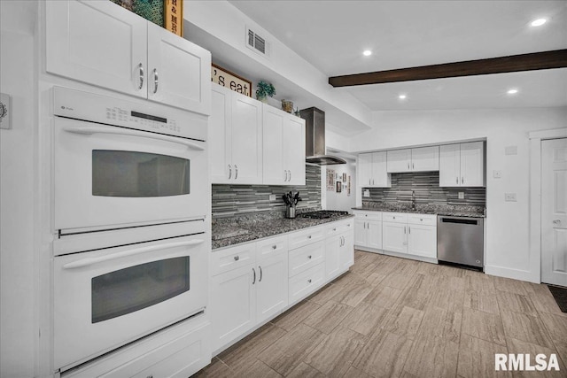 153 Spring Creek Ter, East Peoria, IL 61611 - kitchen featuring appliances with stainless steel finishes, decorative backsplash, white cabinetry, dark stone counters, and recessed lighting