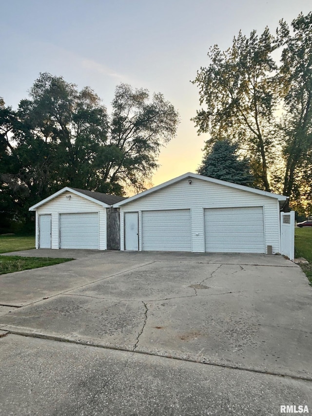 123 N Oak St, Williamsfield, IL 61489 - garage at dusk featuring a garage