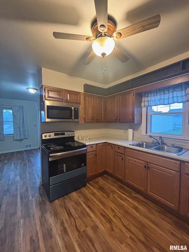 123 N Oak St, Williamsfield, IL 61489 - kitchen featuring stainless steel appliances, a sink, light countertops, and plenty of natural light