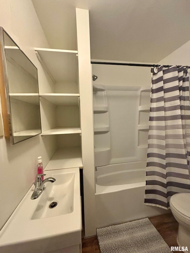 123 N Oak St, Williamsfield, IL 61489 - full bathroom featuring a sink, toilet, shower / bath combo, and wood finished floors
