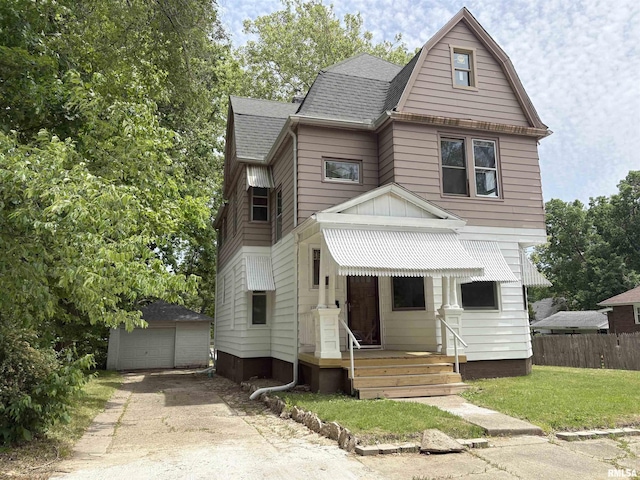 2704 N Dechman Ave, Peoria, IL 61603 - dutch colonial with an outdoor structure, roof with shingles, and a detached garage