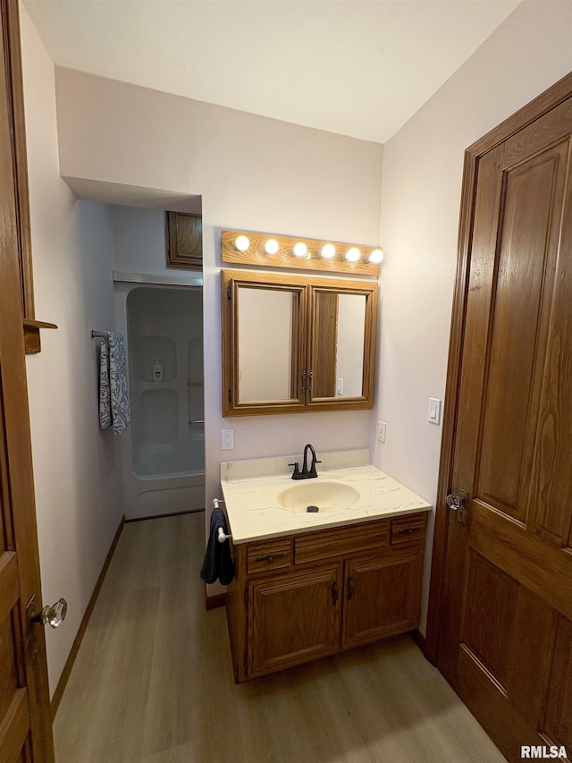 2704 N Dechman Ave, Peoria, IL 61603 - bathroom with wood finished floors and vanity