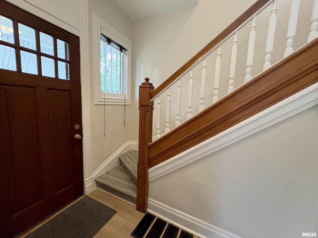2704 N Dechman Ave, Peoria, IL 61603 - foyer entrance with stairway, light wood-style flooring, and baseboards